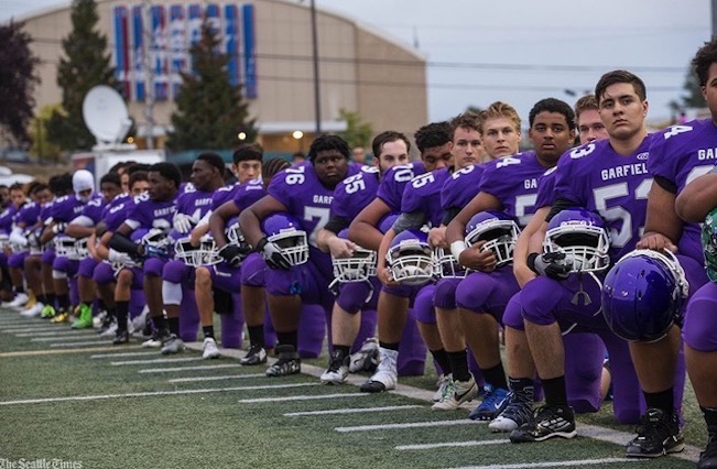 Seattle high school team kneeling
